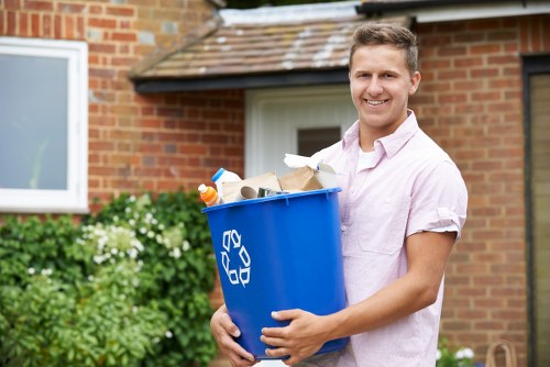 Professional gardener clearing garden debris